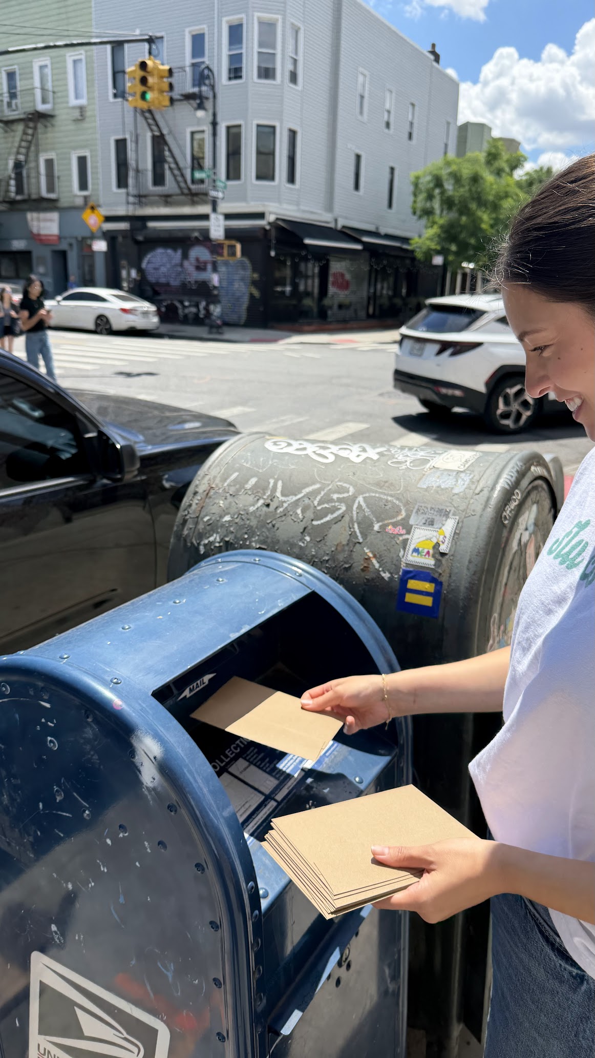 Mailing recipe cards at a neighborhood mailbox