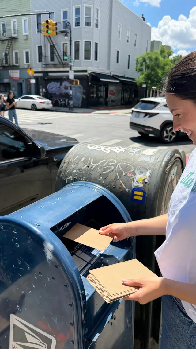 Mailing recipe cards at a neighborhood mailbox